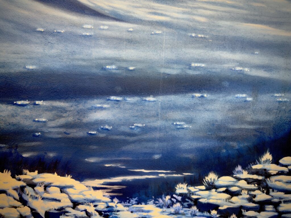 Blue-toned painting of a calm lake with snow-dusted rocks along the shore at the bottom edge of the scene.