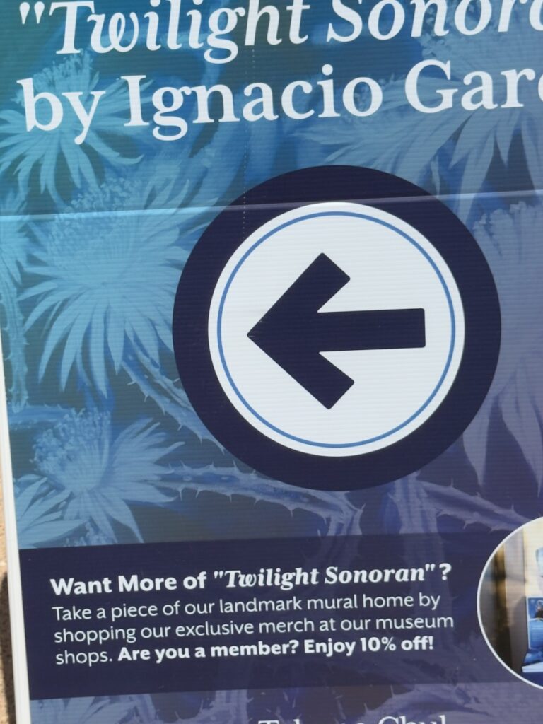 Promotional poster with a large left-arrow icon and text about Twilight Sonoran by Ignacio Gar; includes sale info at bottom.